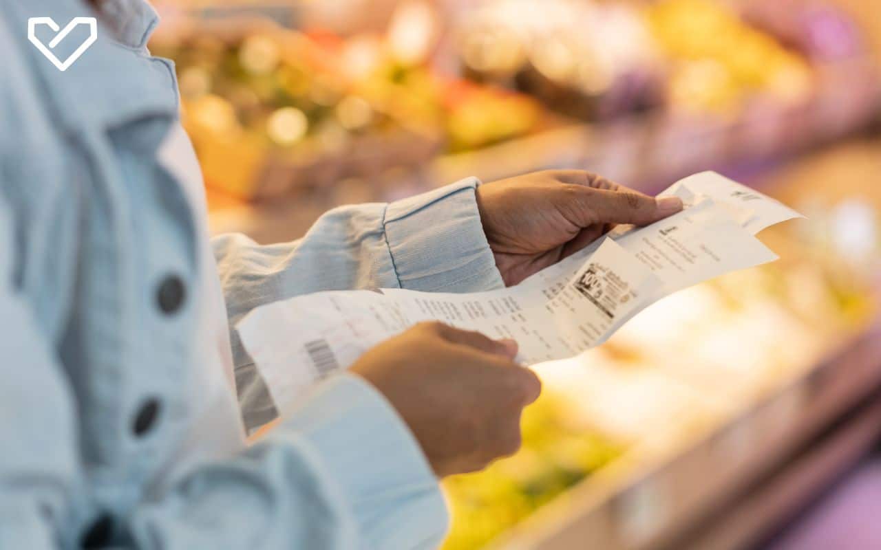 A person reading a shopping receipt