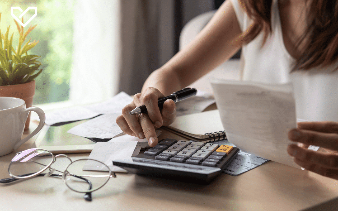 Person calculating mortgage costs