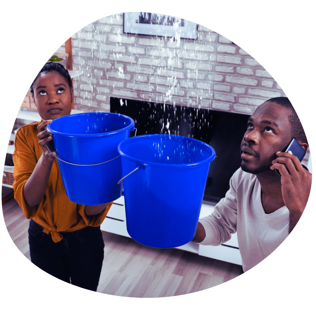 couple with buckets for leaking roof