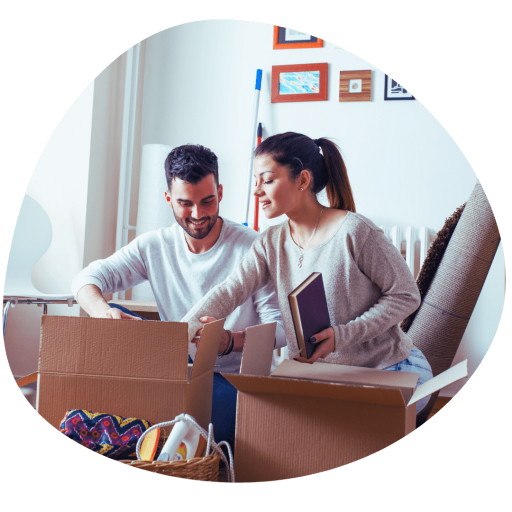 couple boxing up belongings moving house