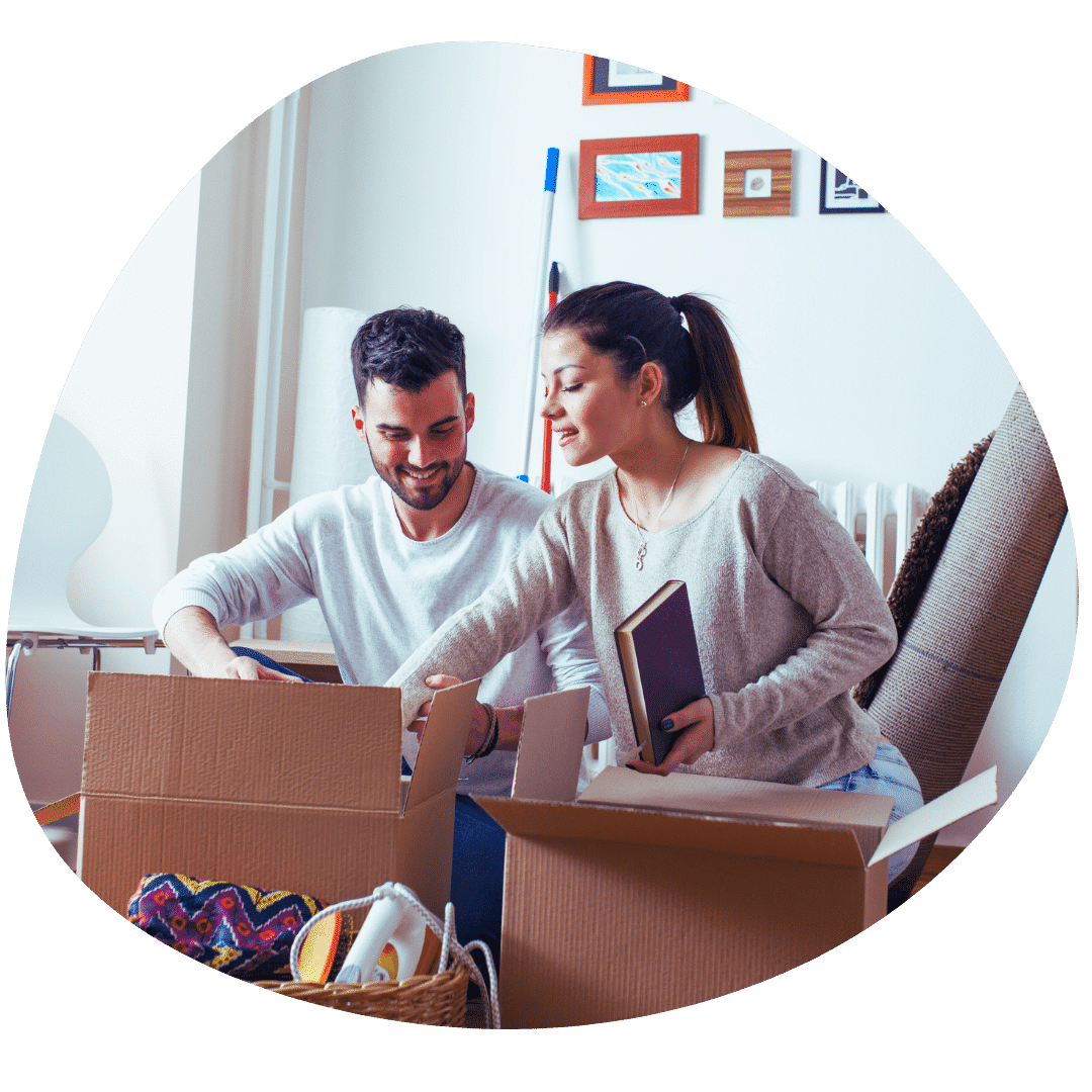 couple boxing up belongings moving house