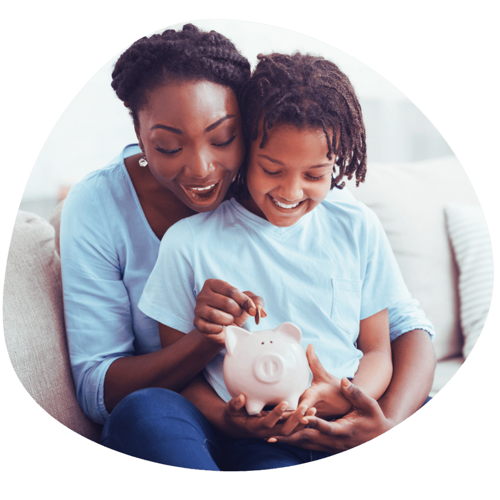 parent and child putting money in piggybank